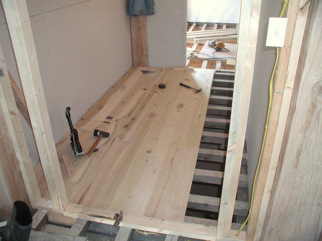 In-progress hardwood floor installation