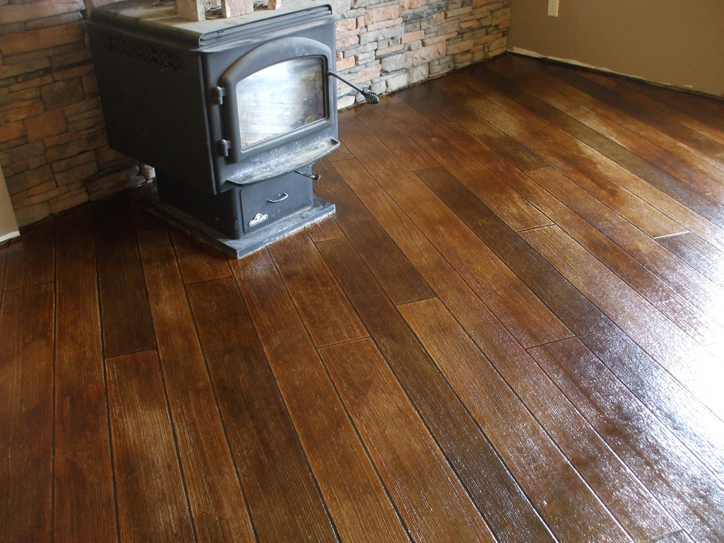 Shiny hardwood floors around a woodstove
