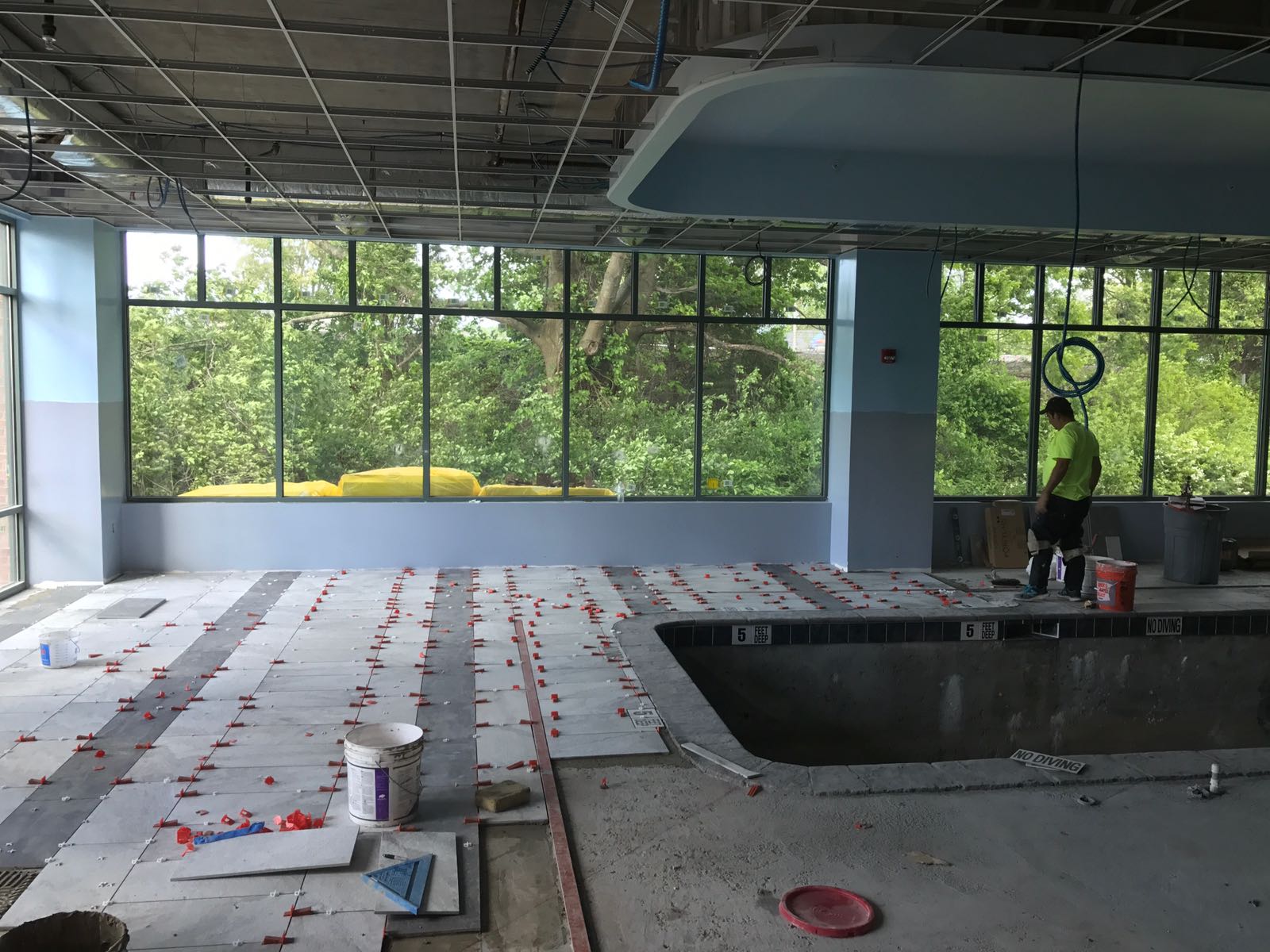 An indoor pool with a new deck being installed