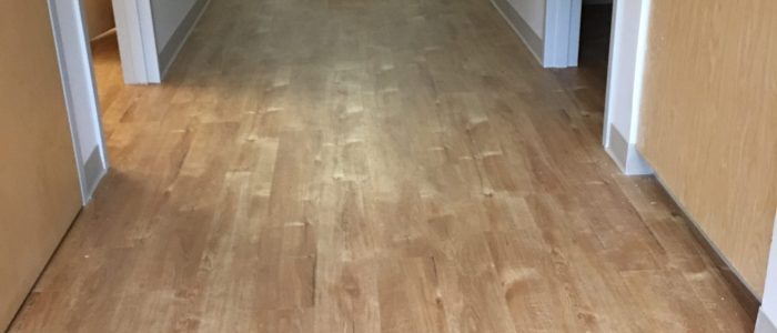 New hardwood floors installed in a hallway