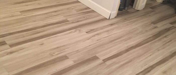 New hardwood floors in a room with white walls