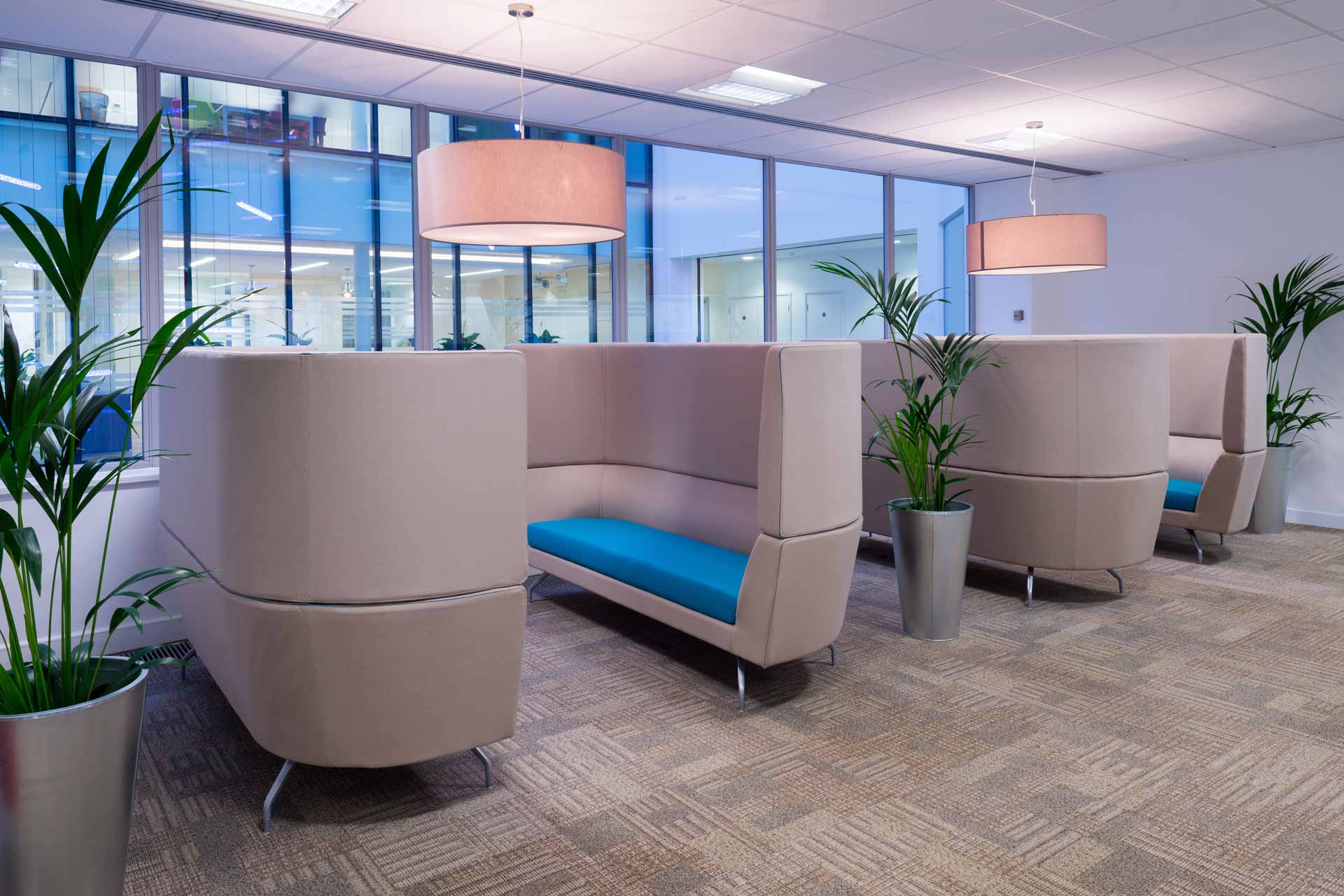 Waiting area in a commercial space with grey carpeting